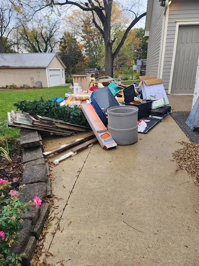 Dumpster being loaded with debris for 30 Yard Dumpster Rental in Ashland